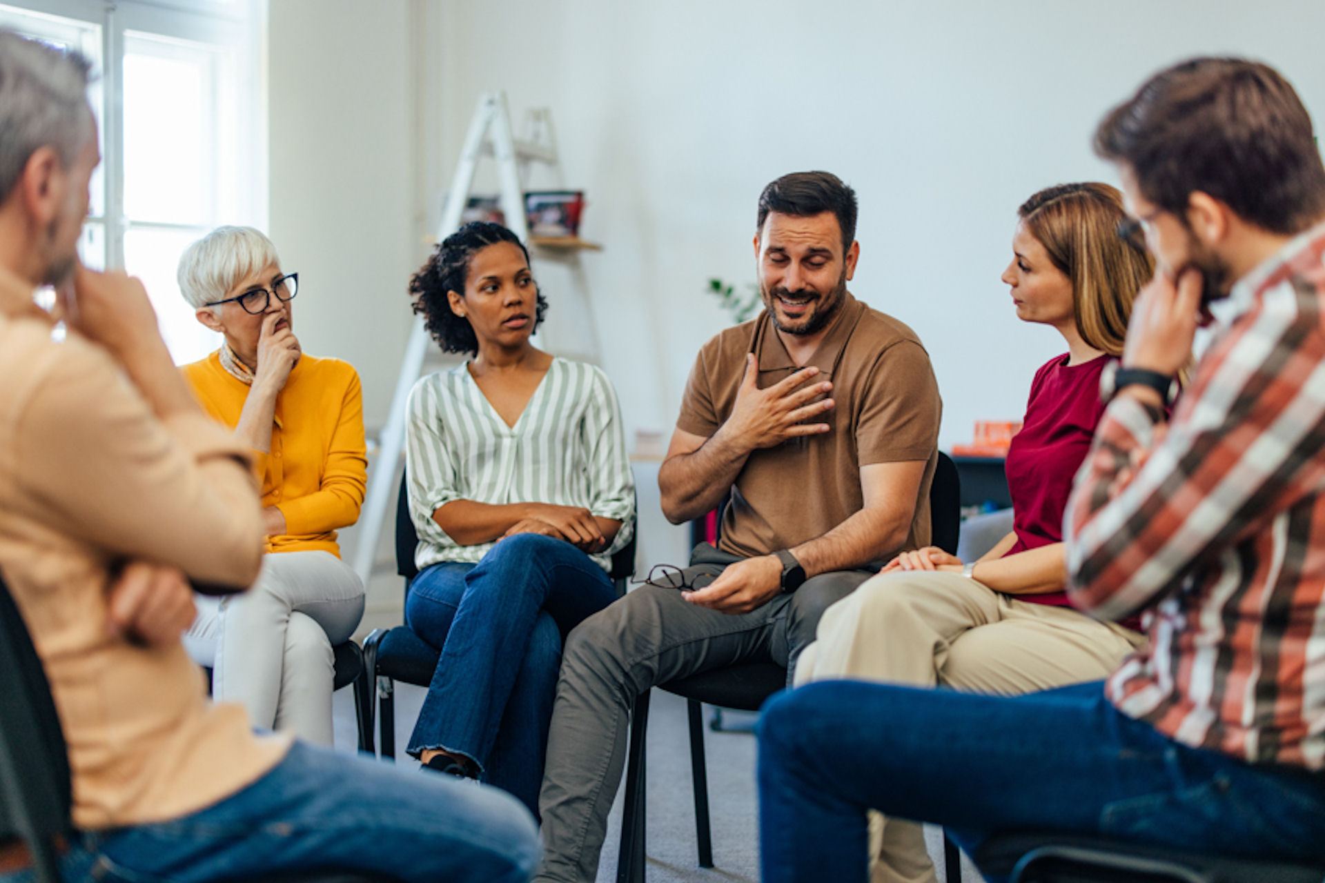 a group of patients on a therapy sitting in a circle