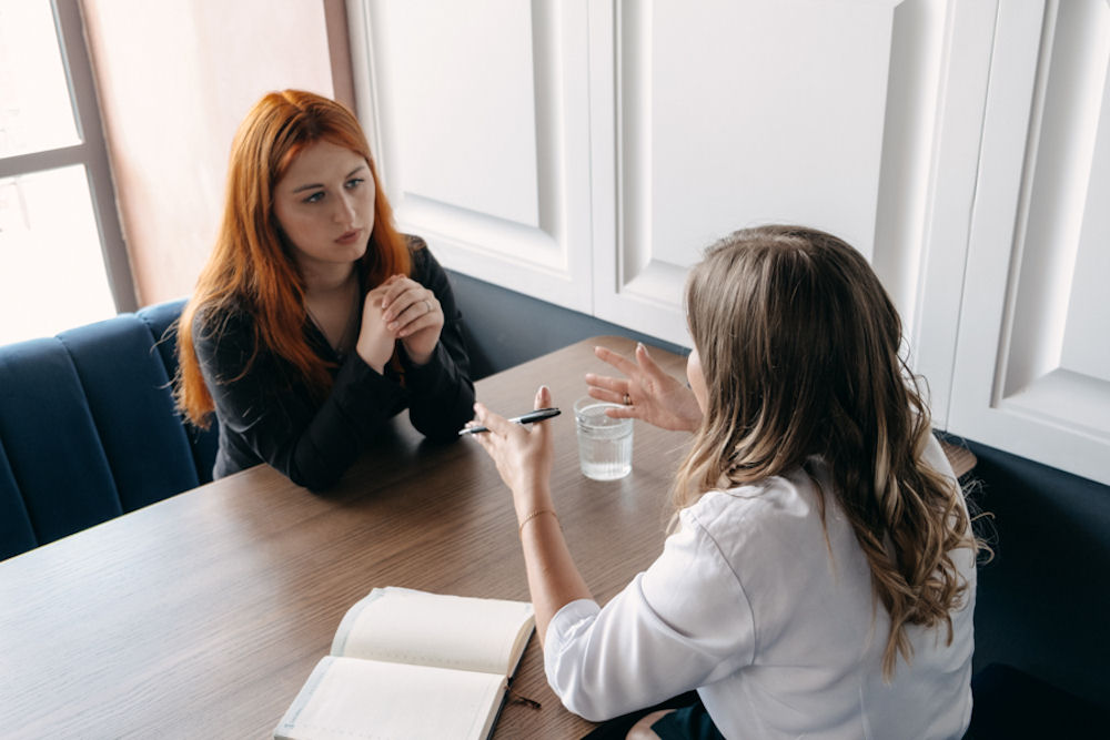 therapist talking to a patient in an individual therapy