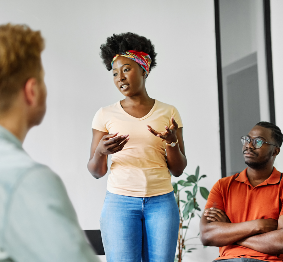 a-woman-standing-up-talking-in-therapy