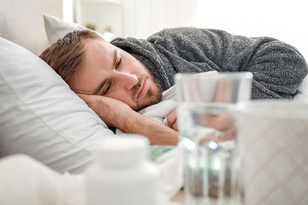 a man laying down with benzos on the table