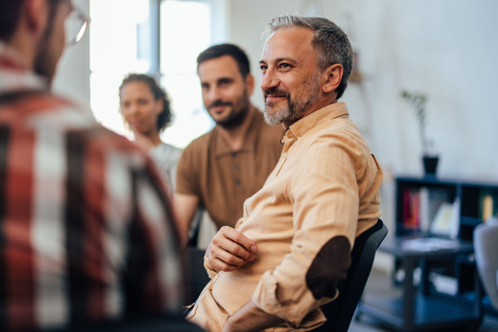 a-group-of-men-and-women-in-therapy