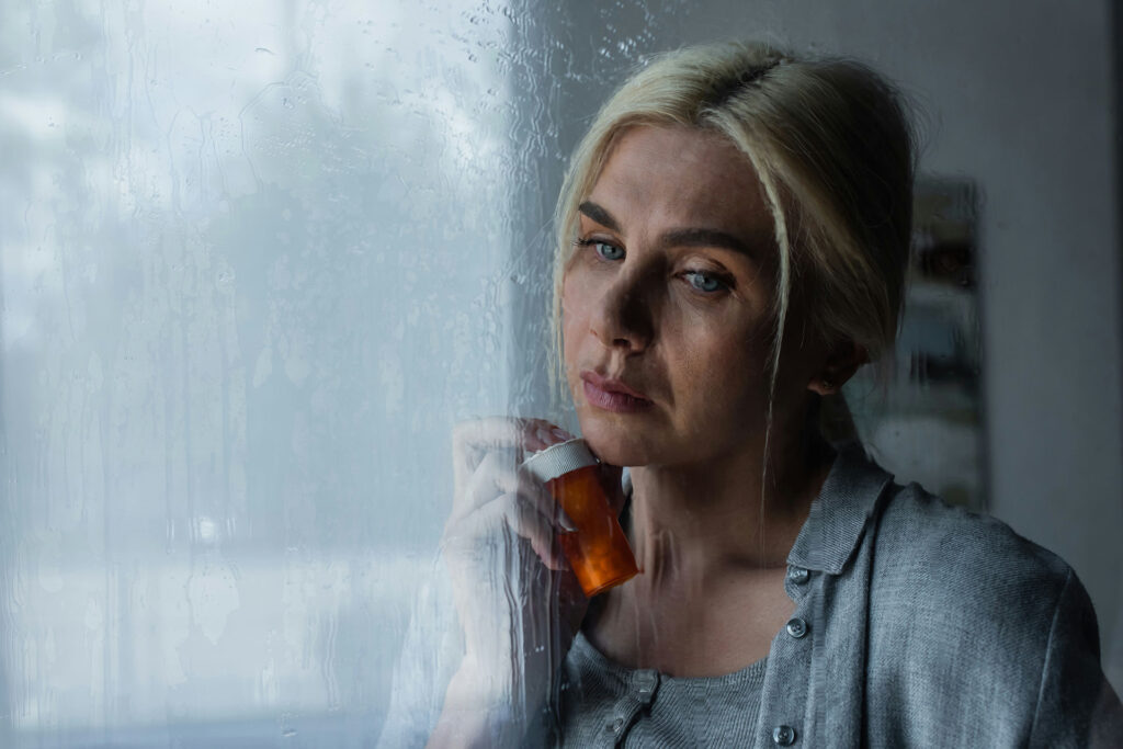 a-woman-holding-pills