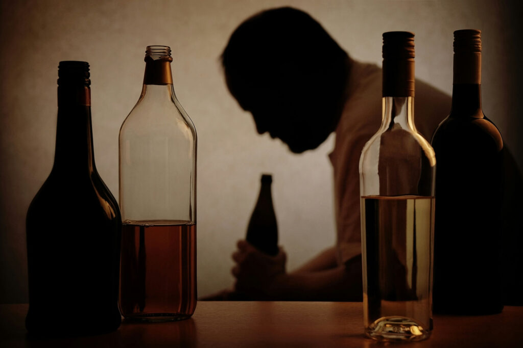 a-man-surrounded-by-alcohol