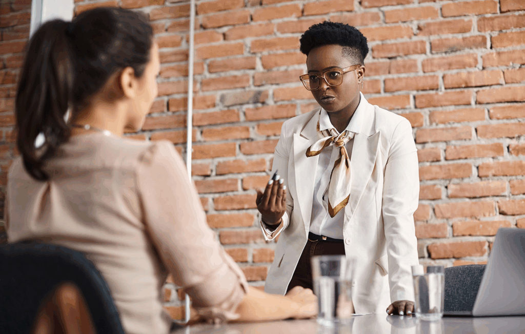 a boss speaking to her employee