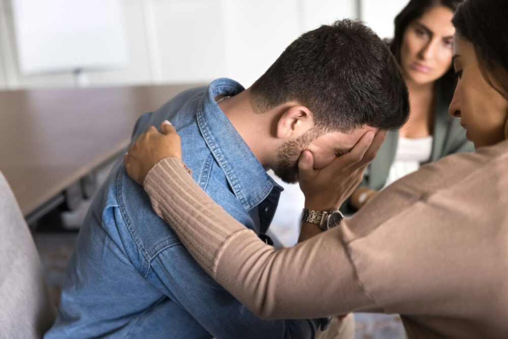 a-man-being-comforted