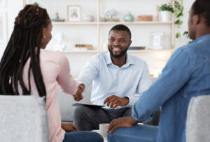 man shakes hands with woman after completing stimulant addiction treatment in Wisconsin
